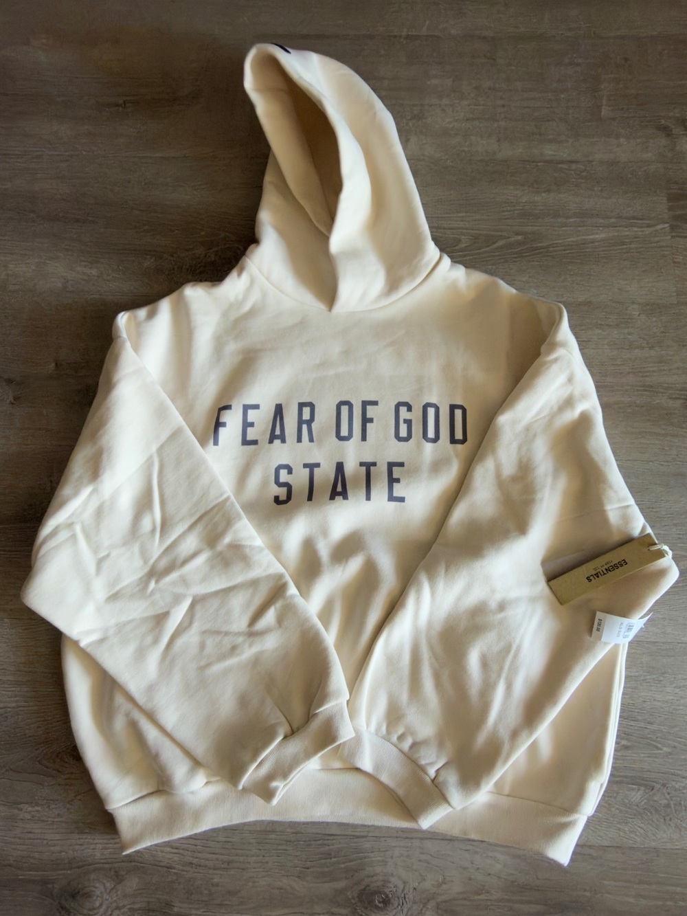Fear of God Essentials Hoodie in Cream/Off-White